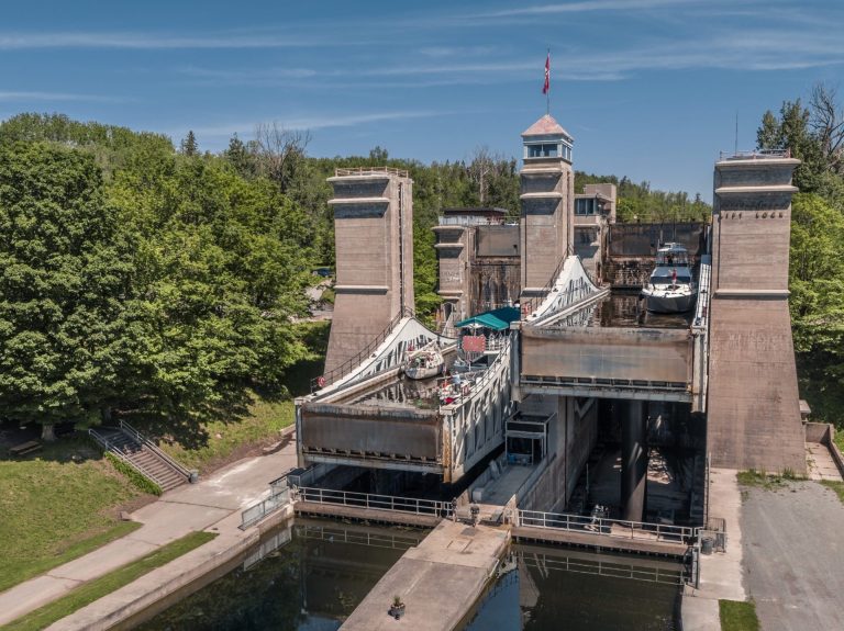 A lift lock raises one basin on a bright day