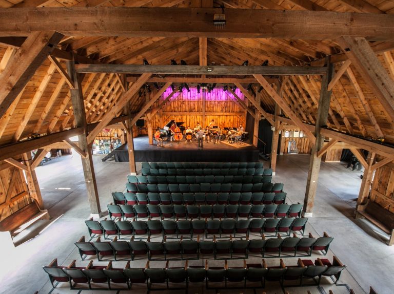 Interior of barn performance space, looking towards stage from above