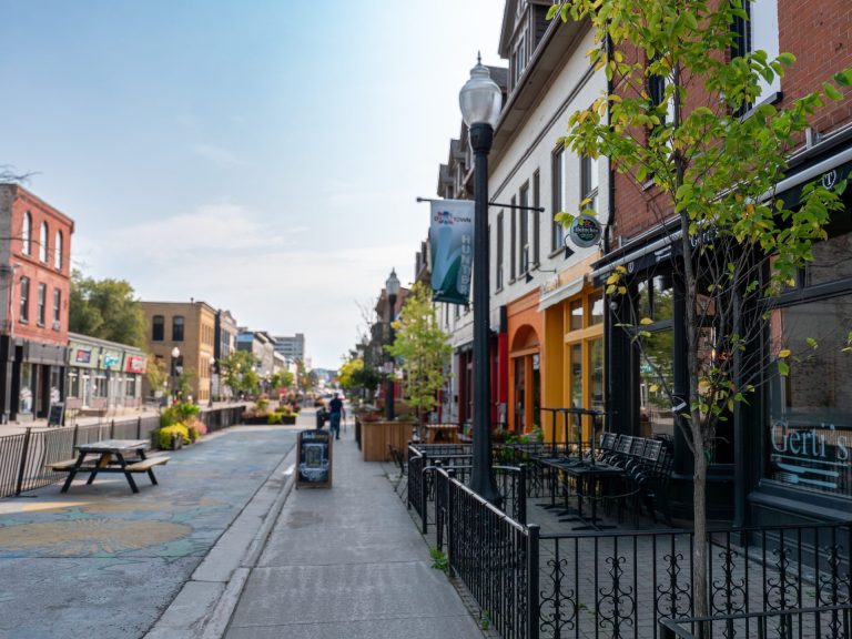 View down a street lined with cafés in summer