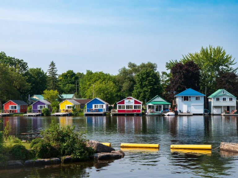 A row of colourful houses, seen from across a waterway